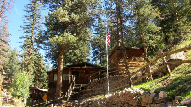 Log buildings near BuckSnort. I am at foot of flag pole
