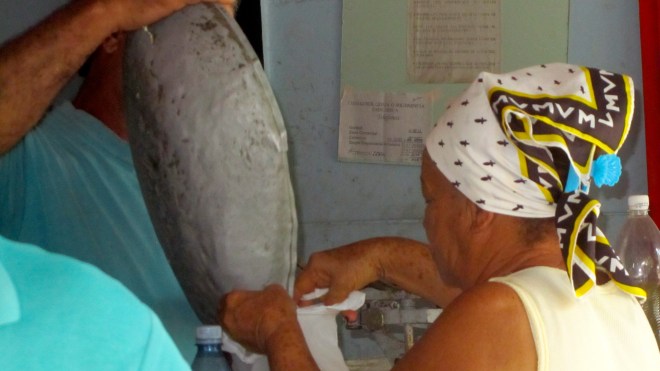 Receiving her monthly rice ration