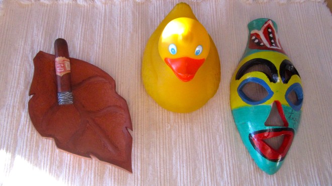 Pottery mask and ashtray with a cigar. So Cuban