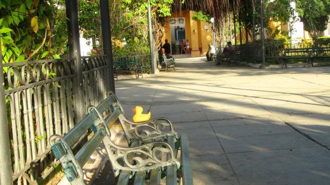 Relaxing on a park bench by Iberostar Trinidad hotel