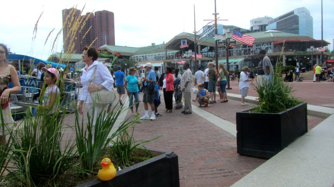 Many people enjoying the Inner Harbor