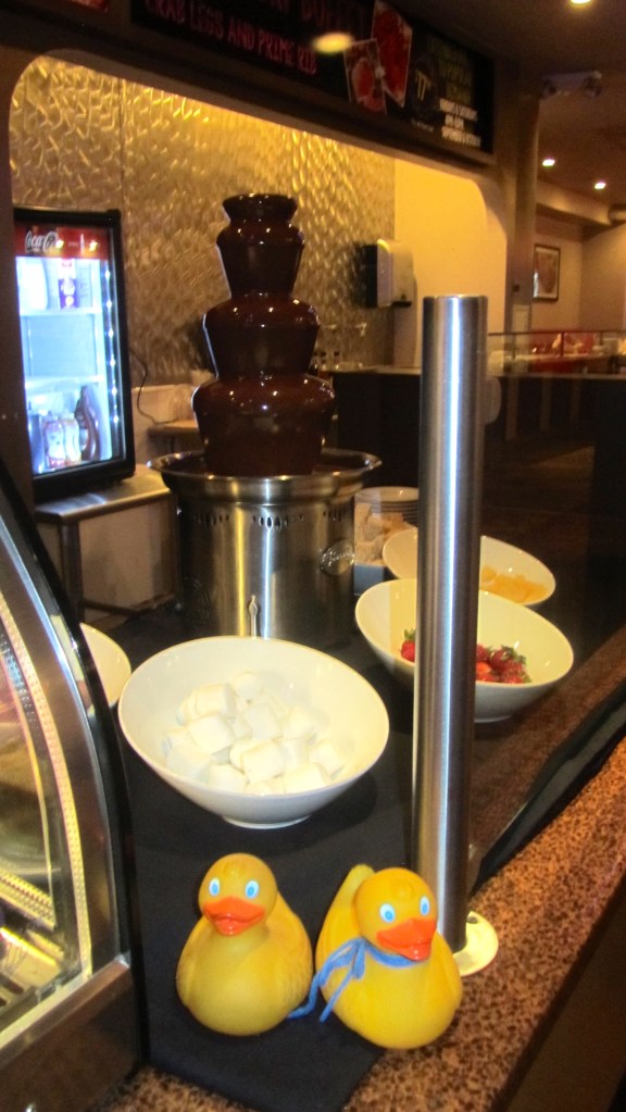 Chocolate fountain with marshmallows, strawberries and more