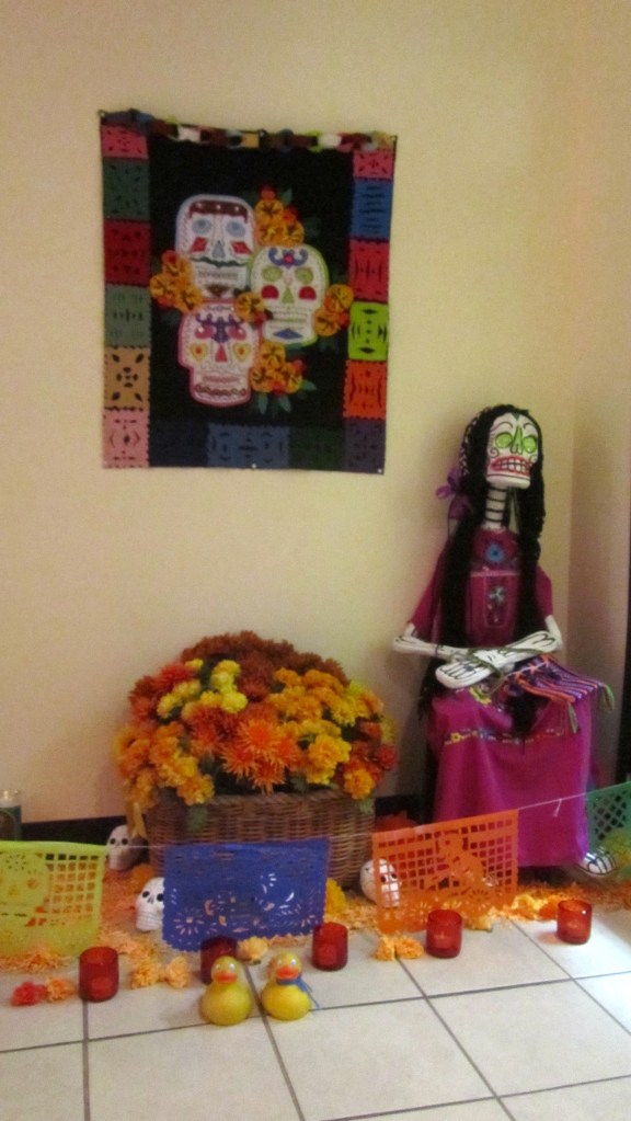 Ofrenta with skeleton person and flowers