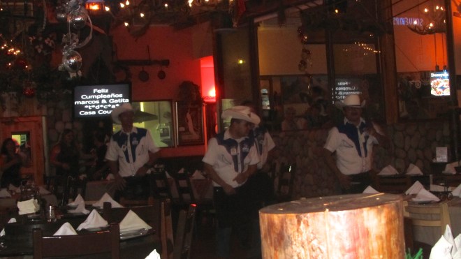 Our waiter is one of the dancers.