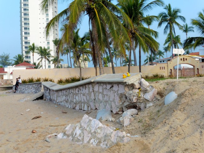 Wall between beach and resort