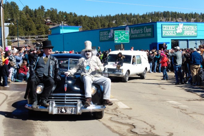 Hearse with live people on hood