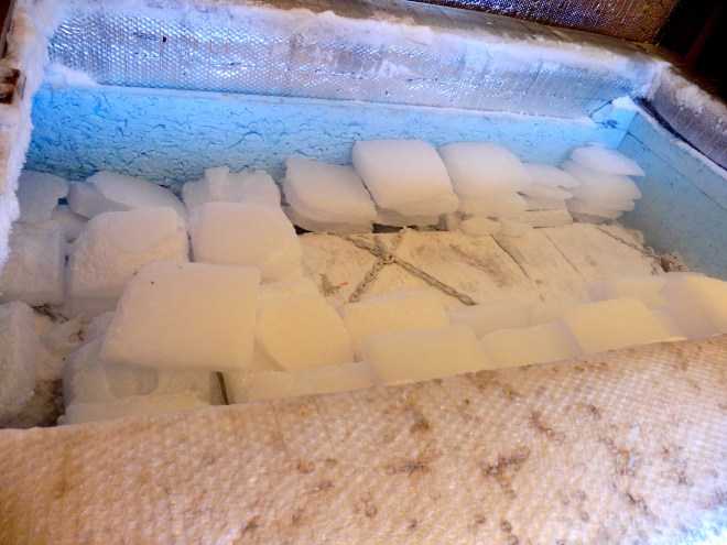 Grandpa's coffin is suspended to allow dry ice under, around and over the coffin