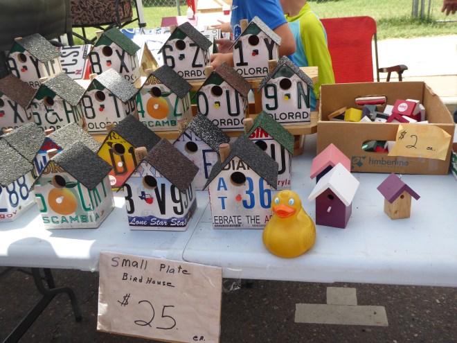 Bird houses made from old license plates