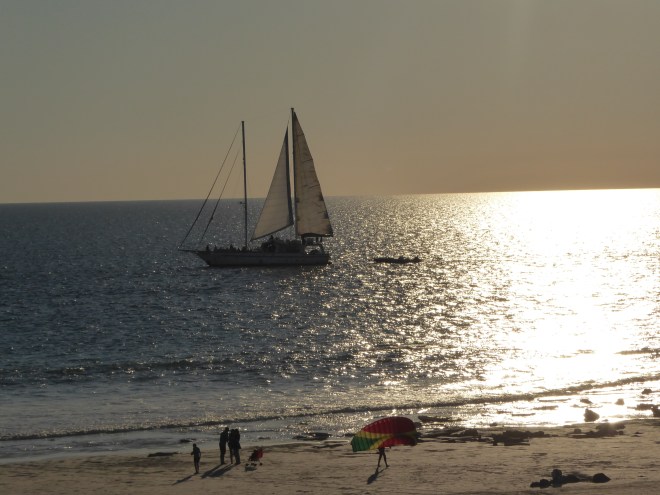 Sailboat with people on beach