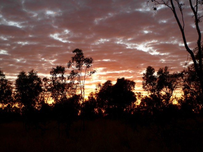 Setting sun through clouds