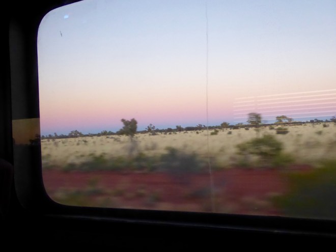 Earth is red approaching Alice Springs this morning. Blurry since train is moving quickly