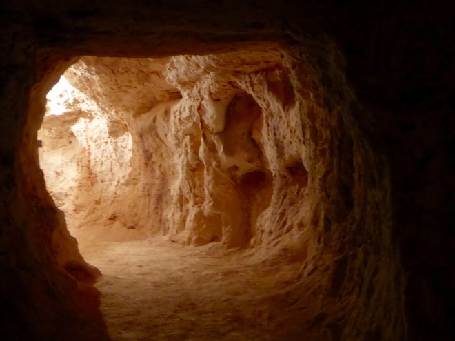 Walking through mine tunnel