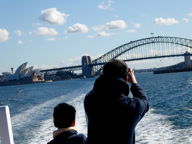 Leaving Sydney Harbor, we look back at the Sydney Opera House and the Sydney Harbor Bridge 