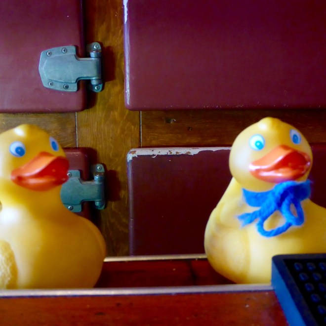 There is a bullet hole in the wall between us