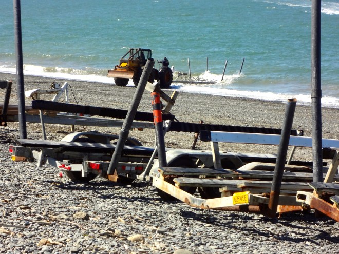 Truck backs boat trailer into water