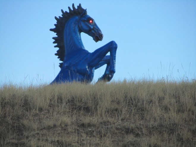 Red eyes on blue horse at Denver International Airport