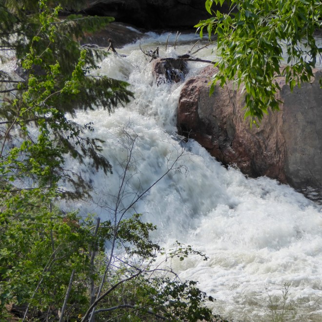 River really moving fast. Winter snow is melting.