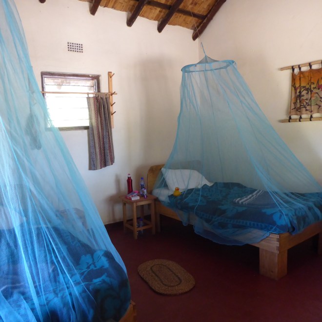 Our room, with mosquito netting over beds