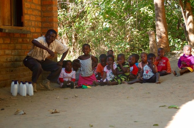 Small group outside with teacher. Working on numbers