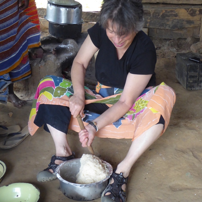 Deborah stirring cassava