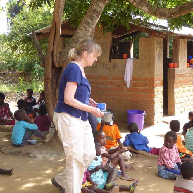 Handing out cups of sweet tea