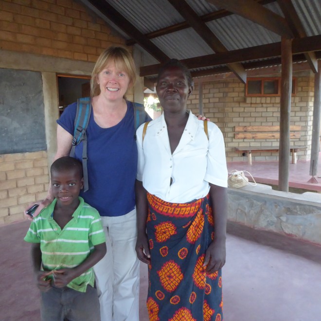 Jenny with adult student and a teachers child