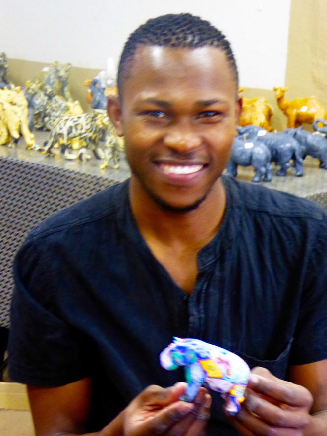 He just finished this elephant candle. We bought it.