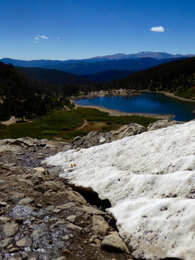 Only one cloud in bright blue sky. Sun is very intense at this altitude
