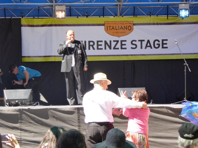 He sings while they dance