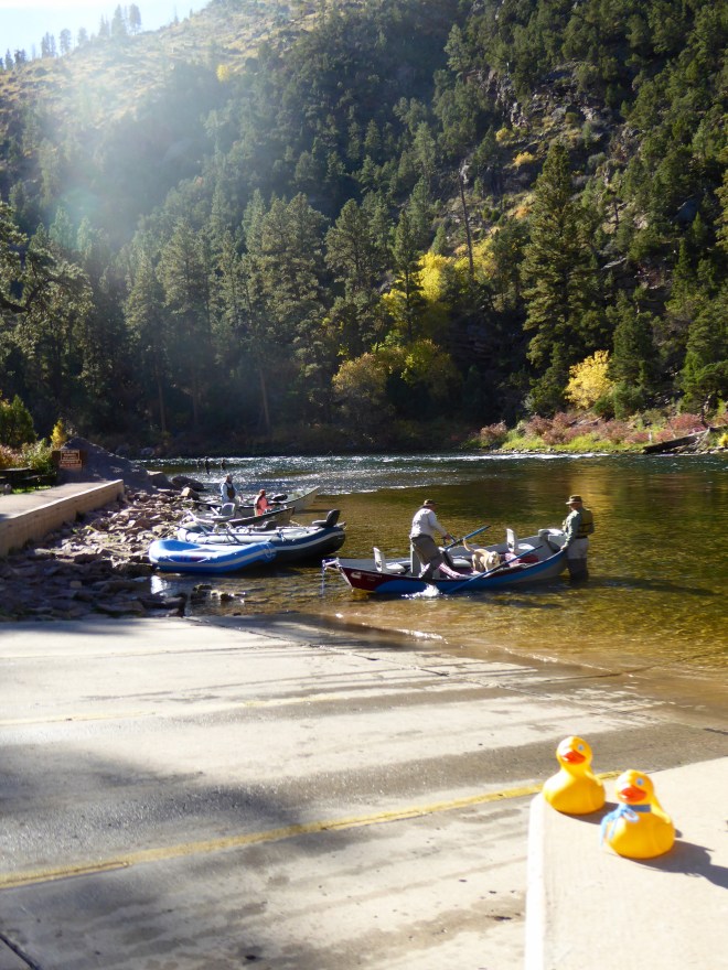 Boats and fisherman in river