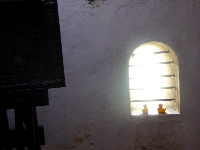 In jail. Looking through bars to the sea