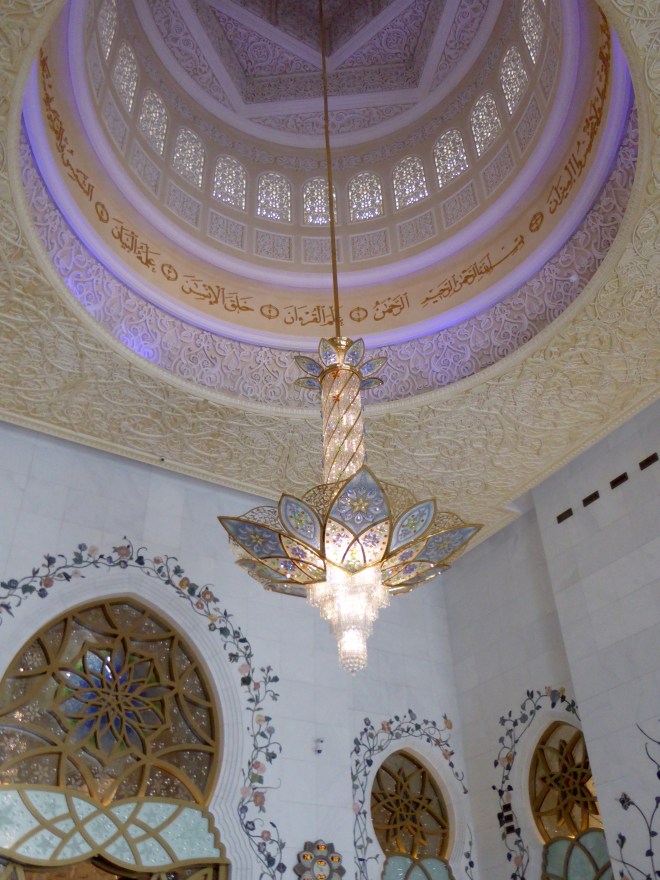 Chandelier hanging from dome